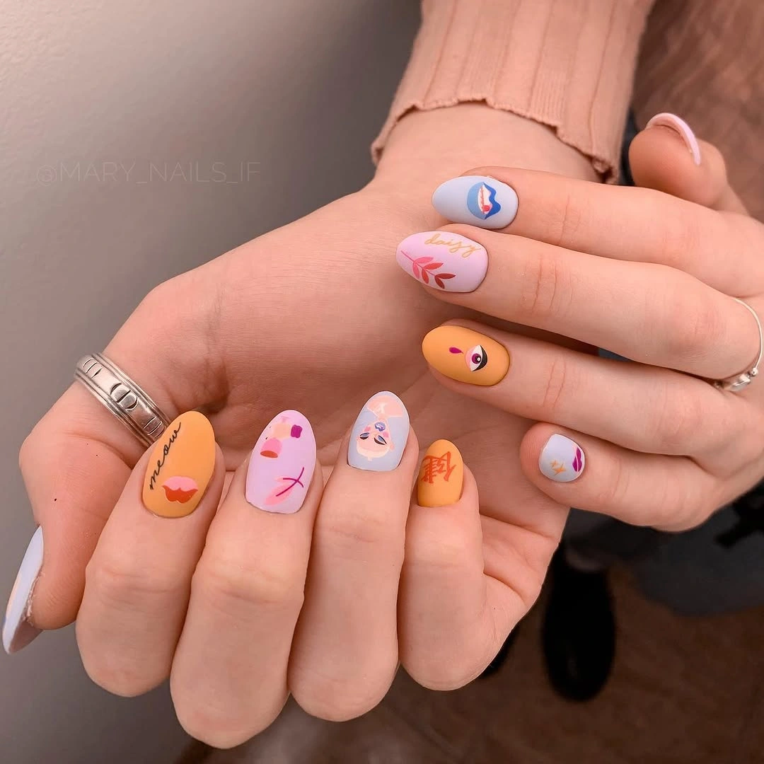 Peach and lavender nails with tiny illustrated art
