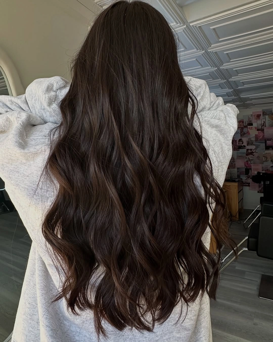 Very dark chocolate hair with large rounded waves