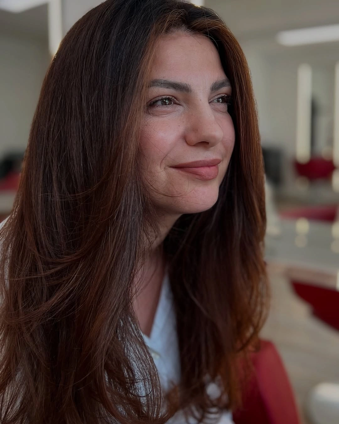 Medium brown waves with soft warm face framing