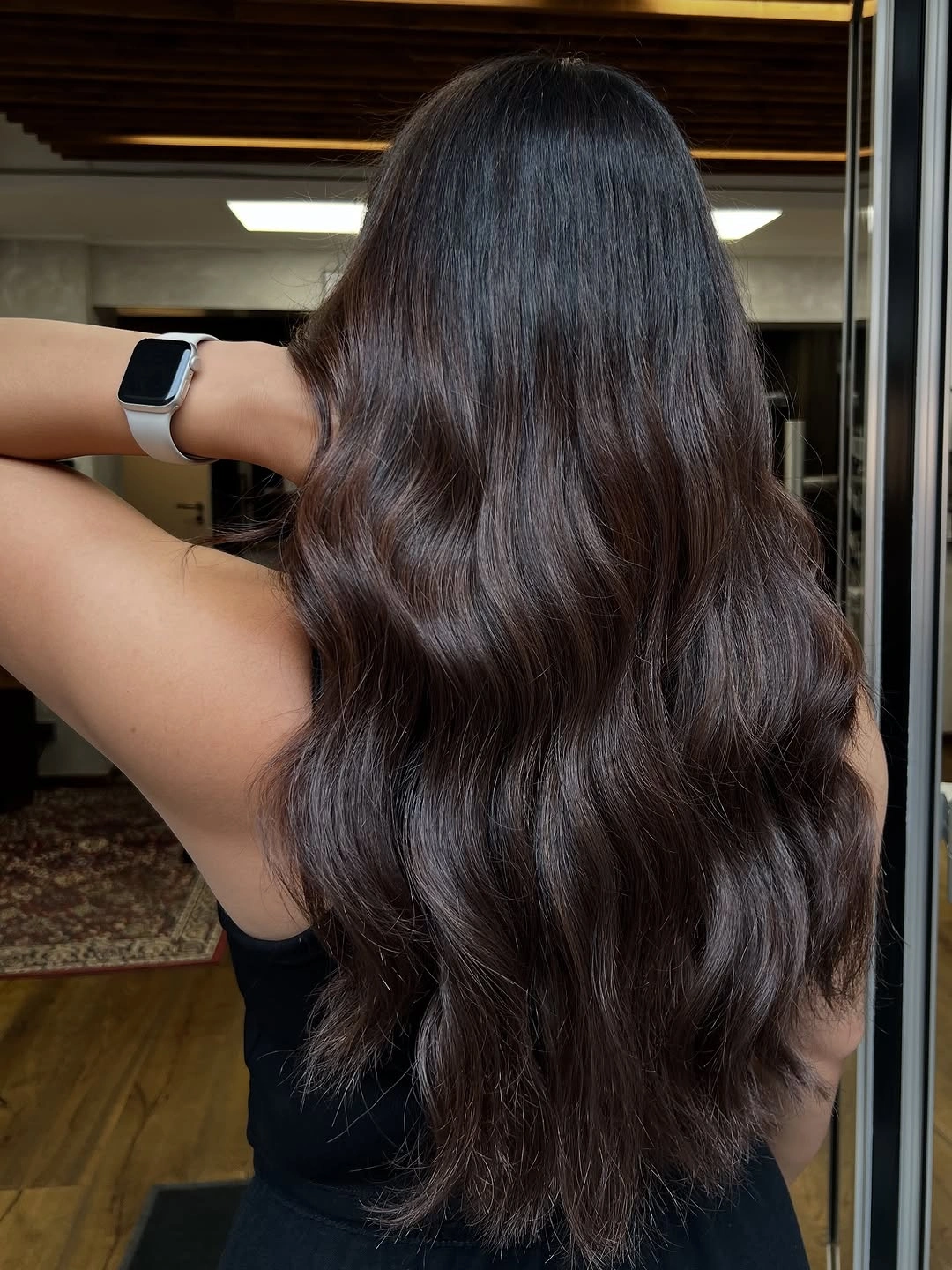 Very long dark cocoa hair with rounded waves