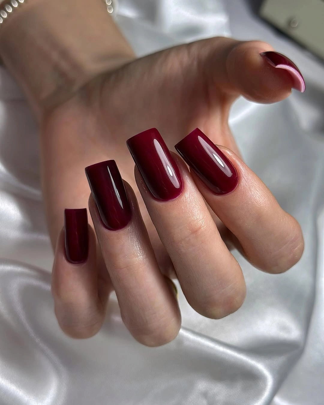 Medium burgundy square coffin nails in a solid glossy finish