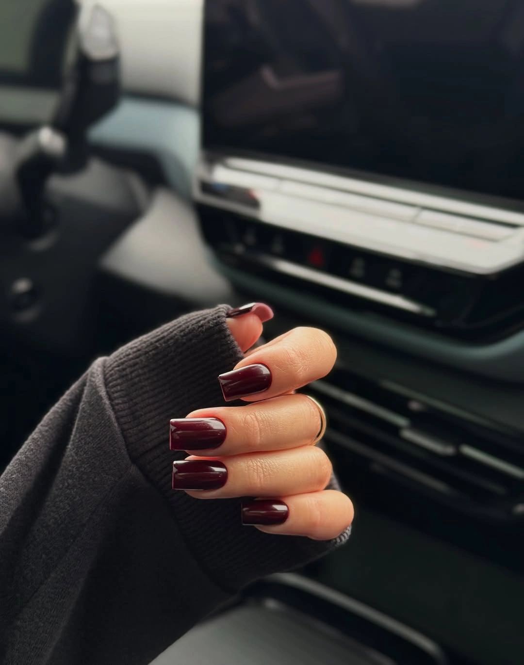 Medium short glossy burgundy square nails in a solid color