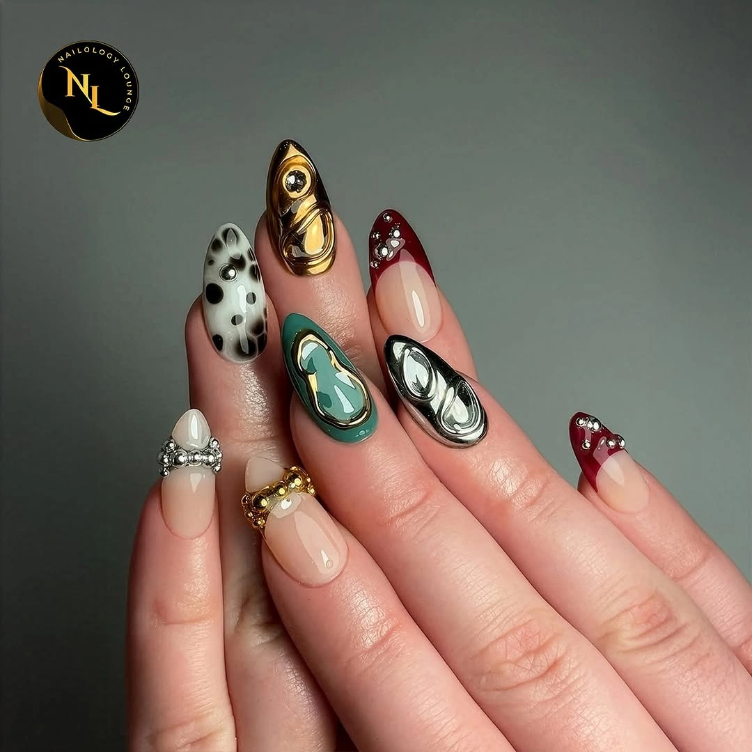 Eclectic dark manicure with turquoise gold pearl and burgundy accents