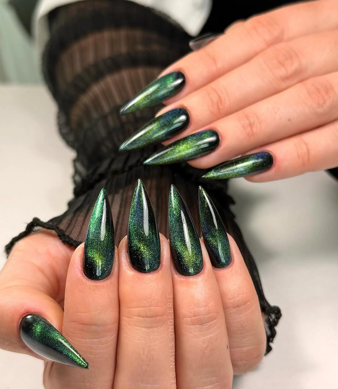 Pointed black nails with vivid red reflective panels