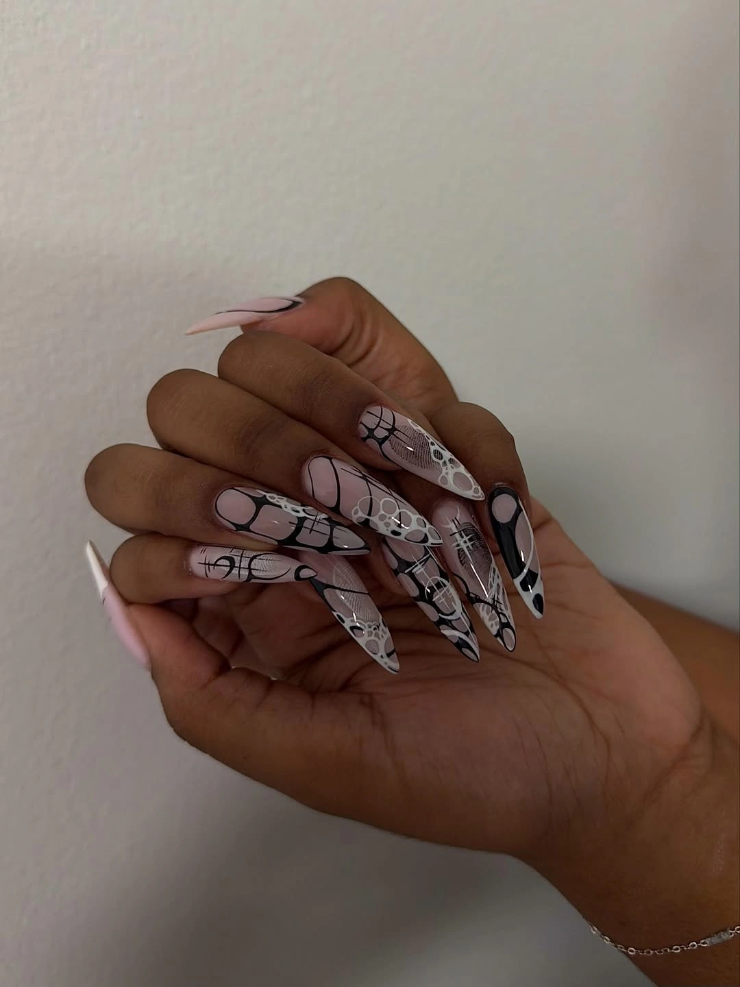 Black and silver chrome nails with rounded medium shape