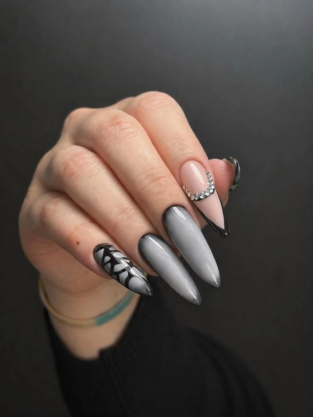 Pearly grey pointed nails with black white sketch accent