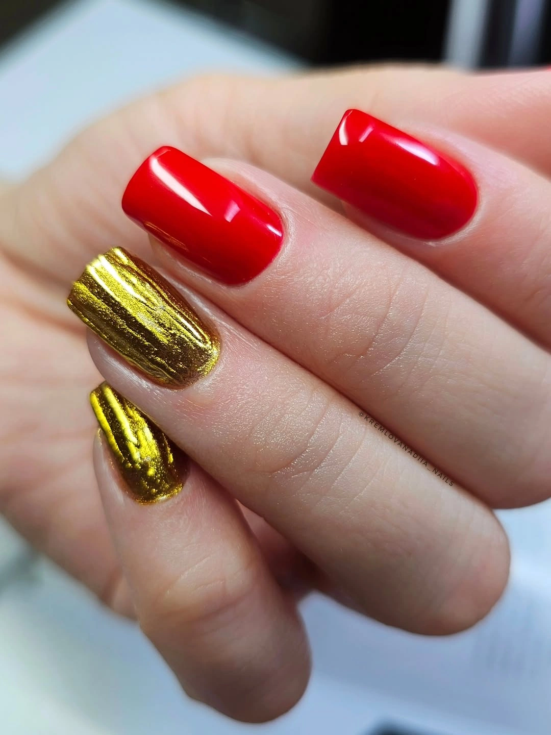 Medium red square nails with gold accents