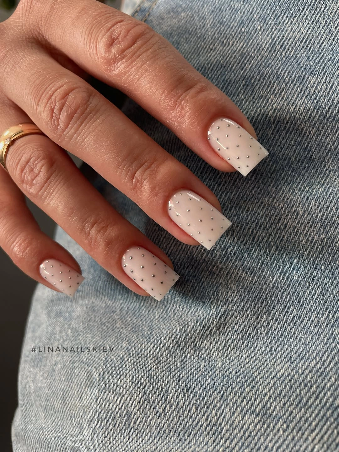 Short ivory square nails with tiny taupe speckles