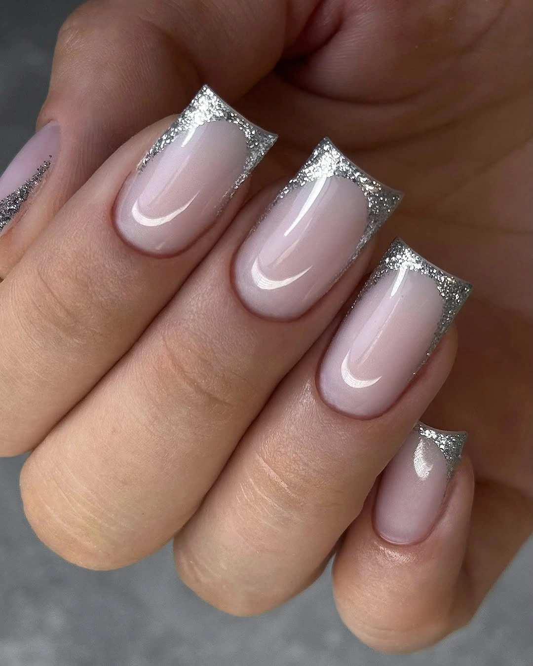 pale pink square nails traced with silver glitter tips