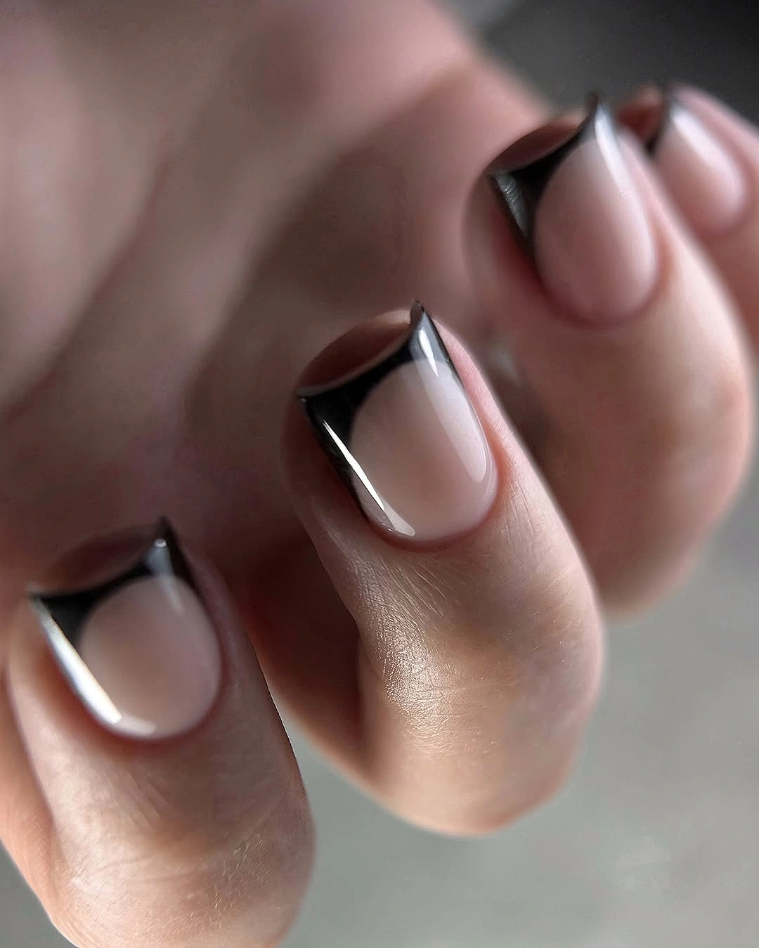 short pink nails with slim black French tips