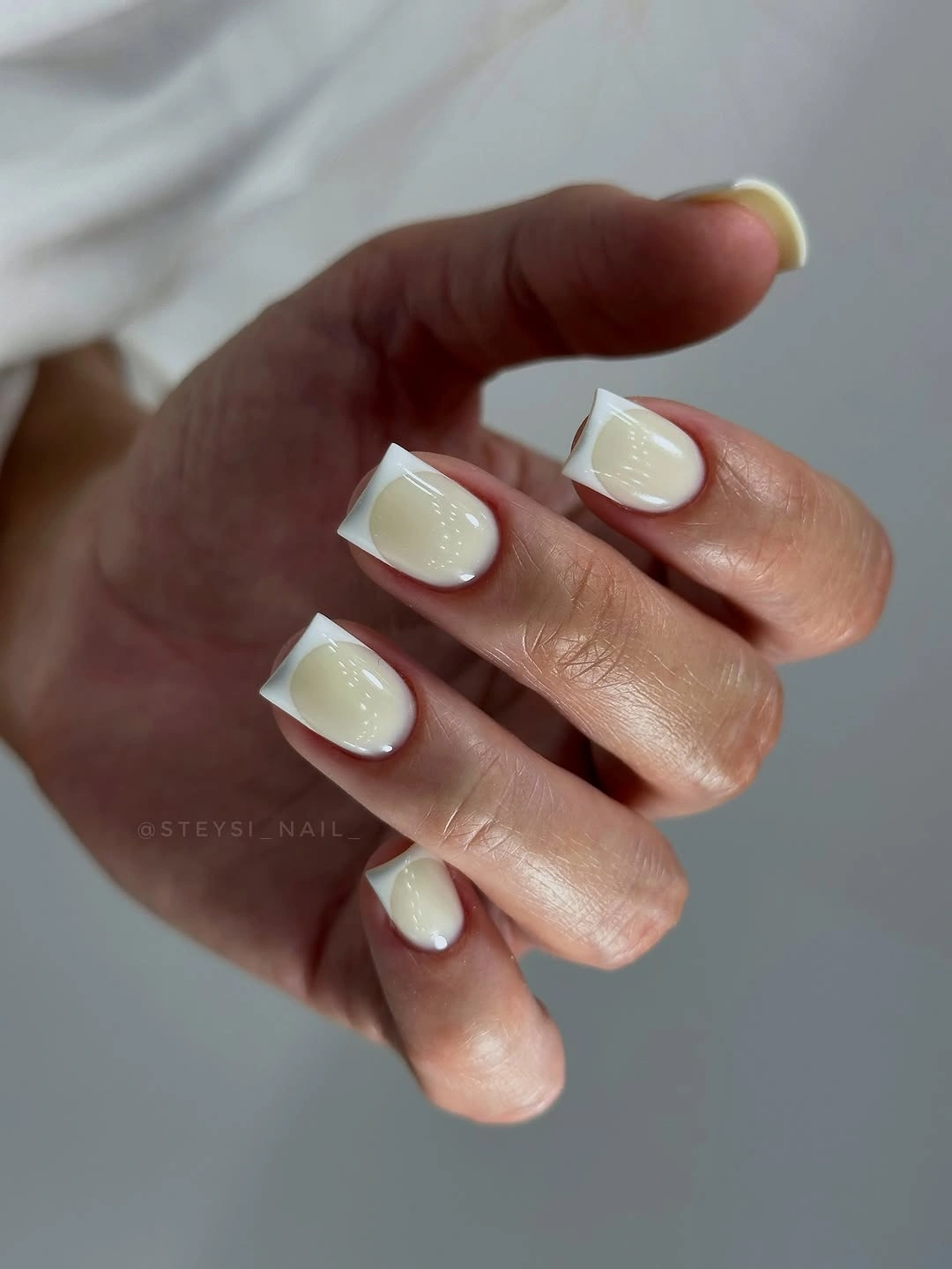 short creamy square nails with pale raised French edges