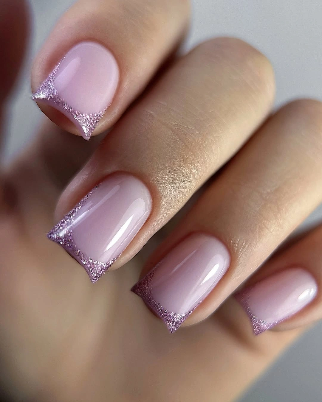lavender pink square nails with shimmering purple French tips