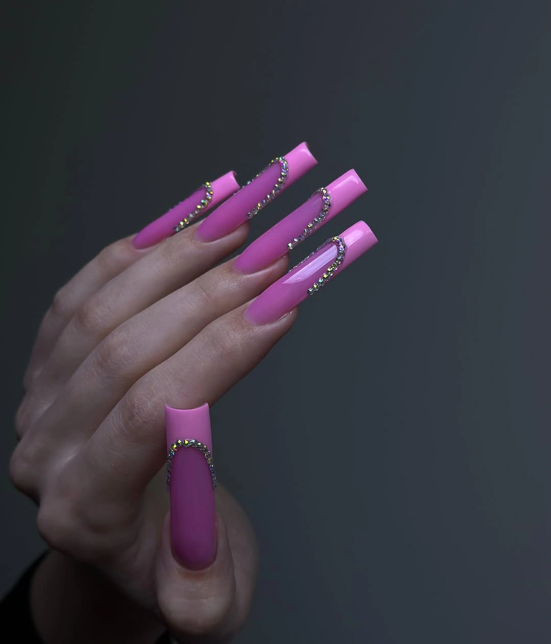 Very long hot pink square nails with bright edge accents