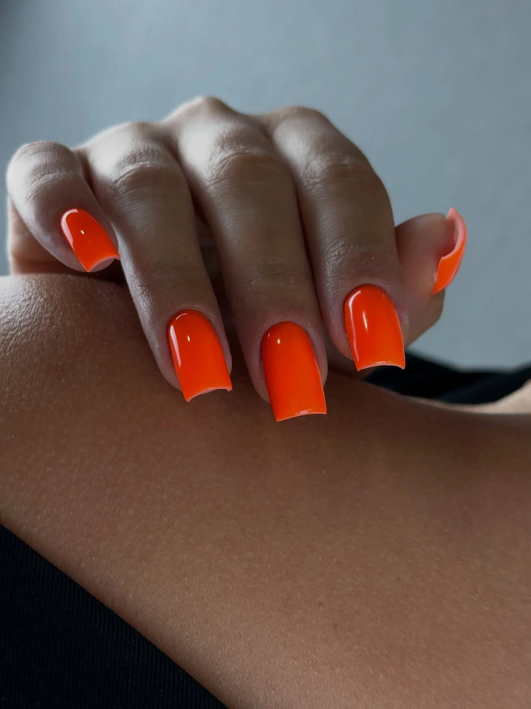 Long square nails in glossy saturated bright orange