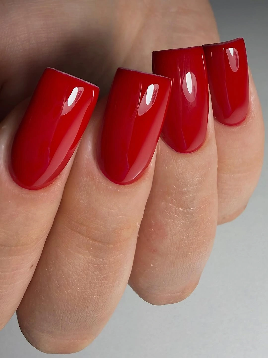 Medium rounded-square nails in glossy bright red
