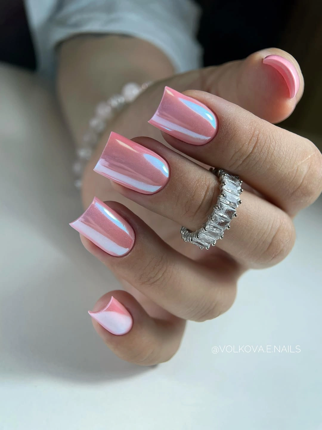 Medium pink square nails with cool reflective highlights
