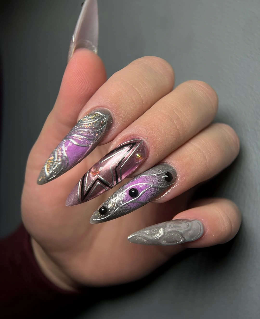 Long almond nails with silver violet and black metallic panels