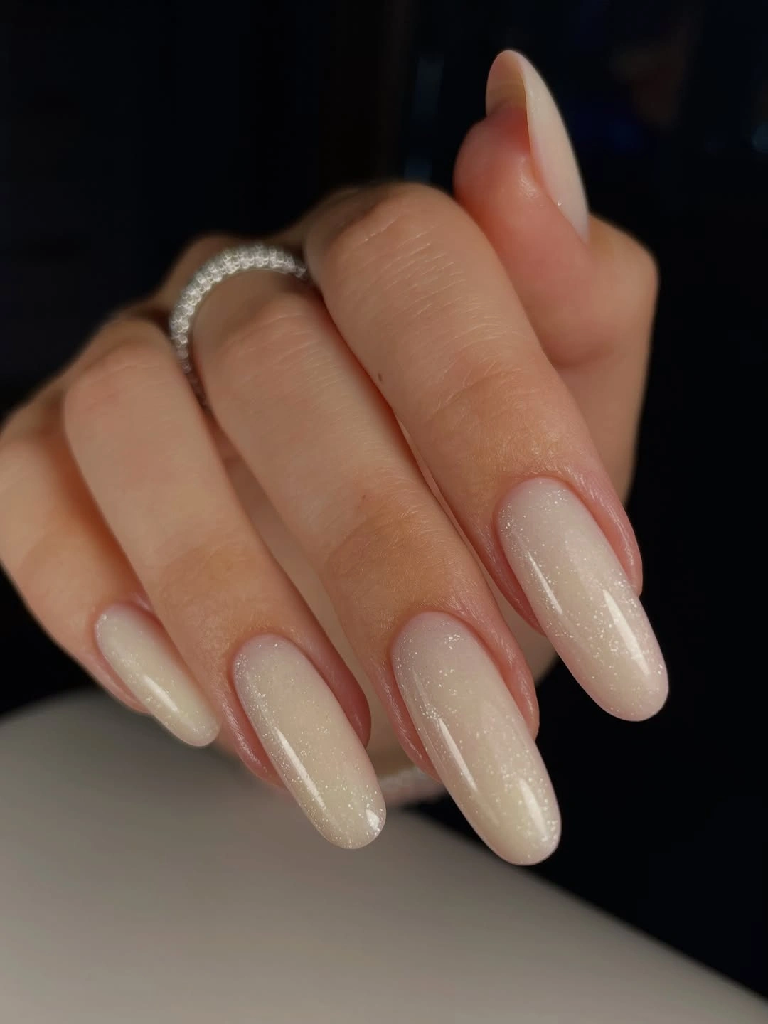 Long almond nails with pearly milky nude shine
