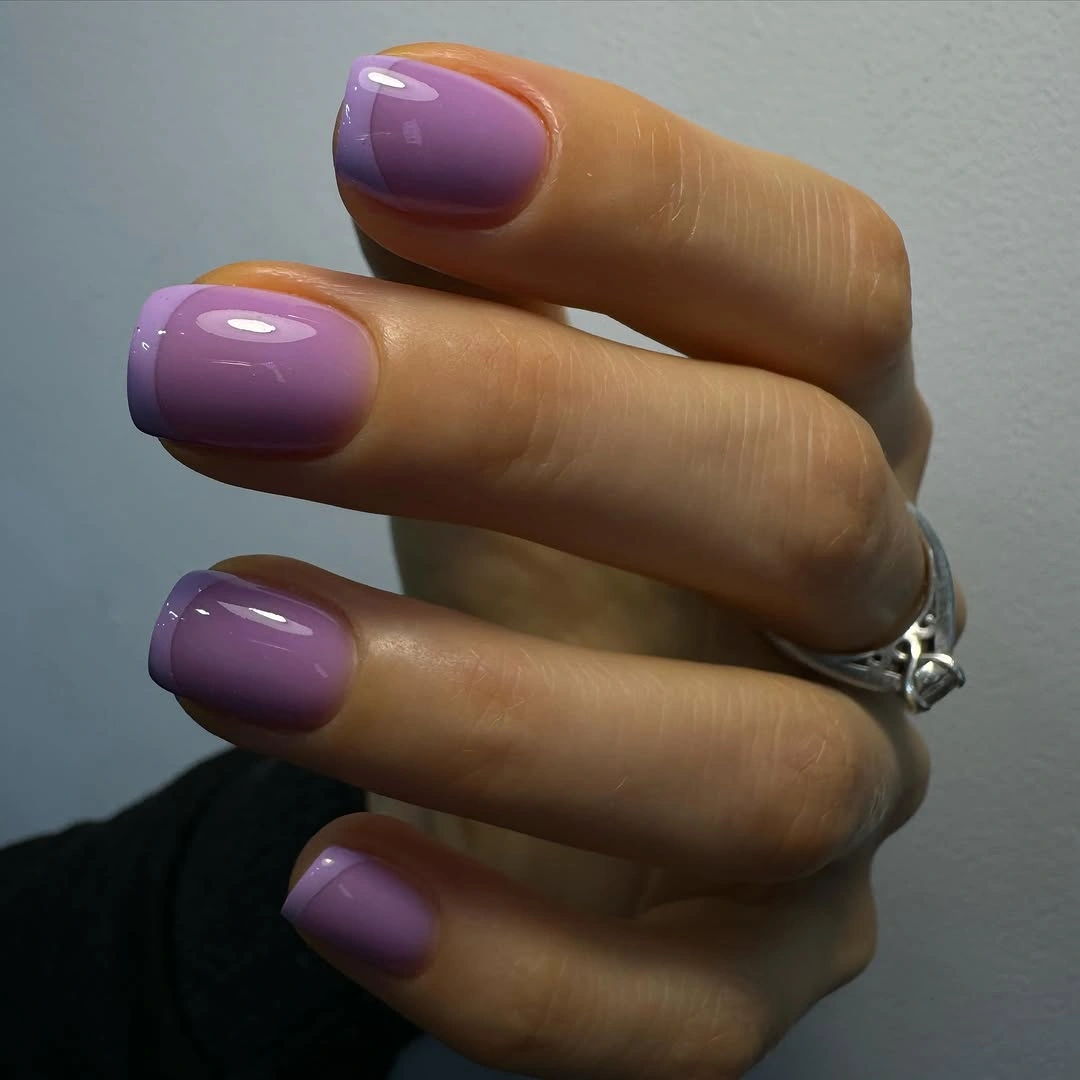 Glossy lilac rounded-square nails in a solid color