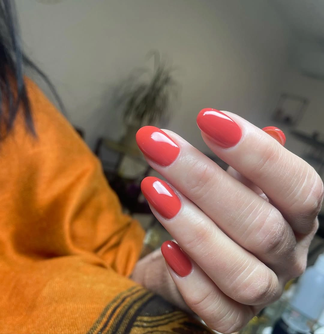 Bright coral red glossy rounded medium nails