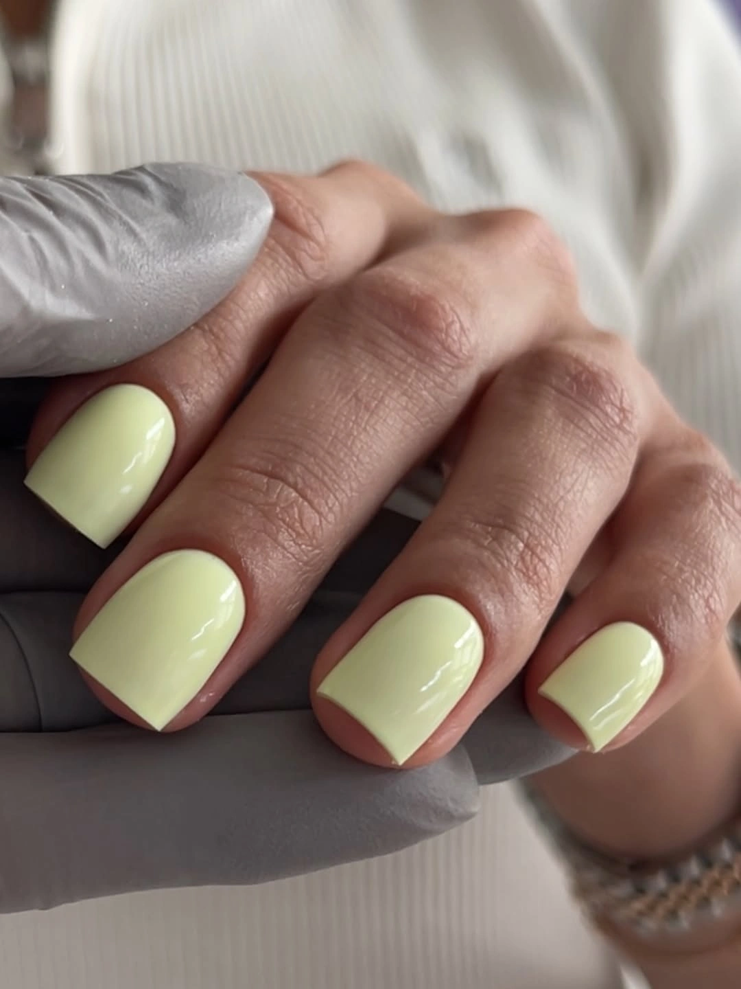 Pale yellow green glossy rounded-square nails