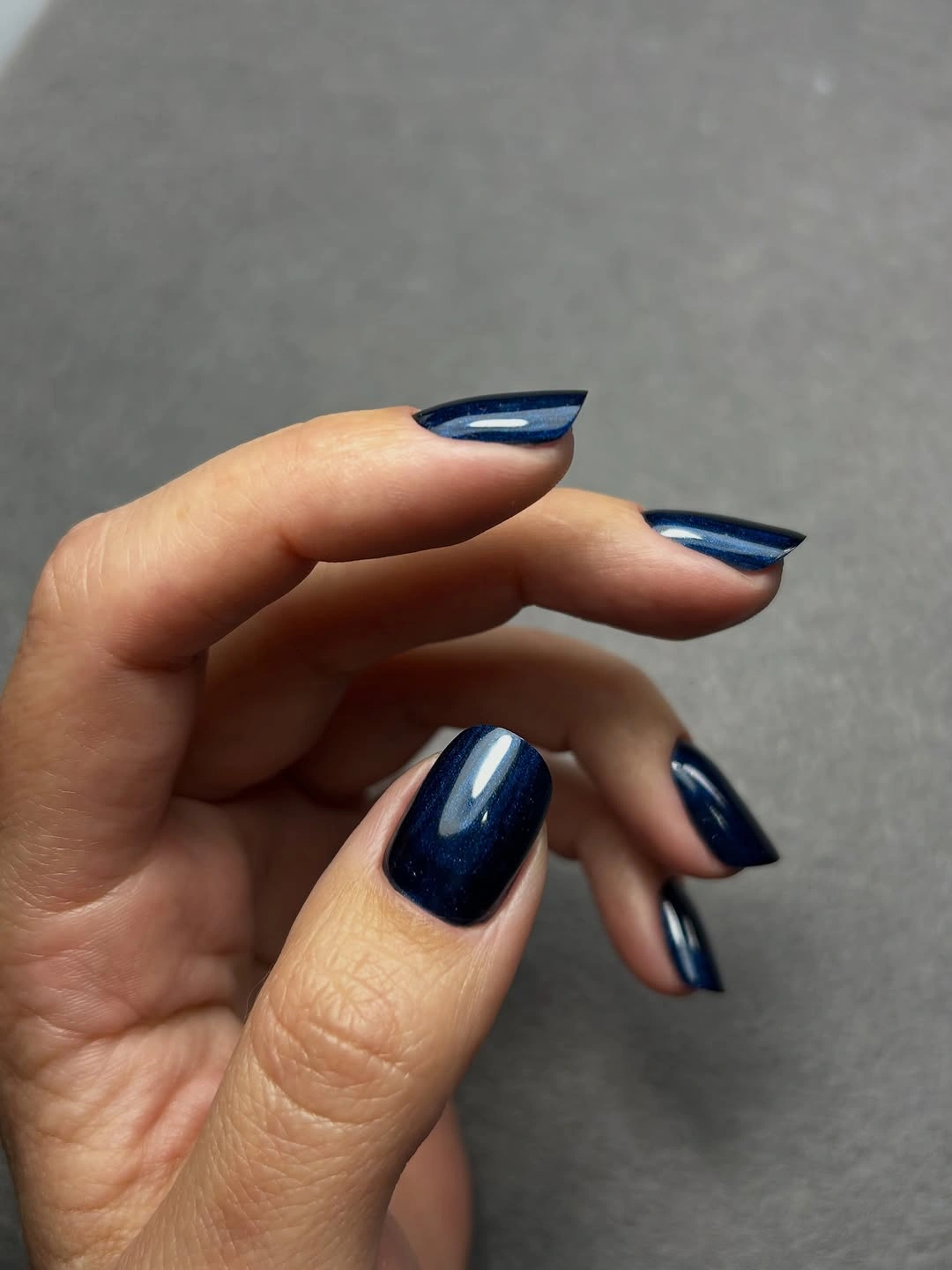 Deep navy glossy long almond nails