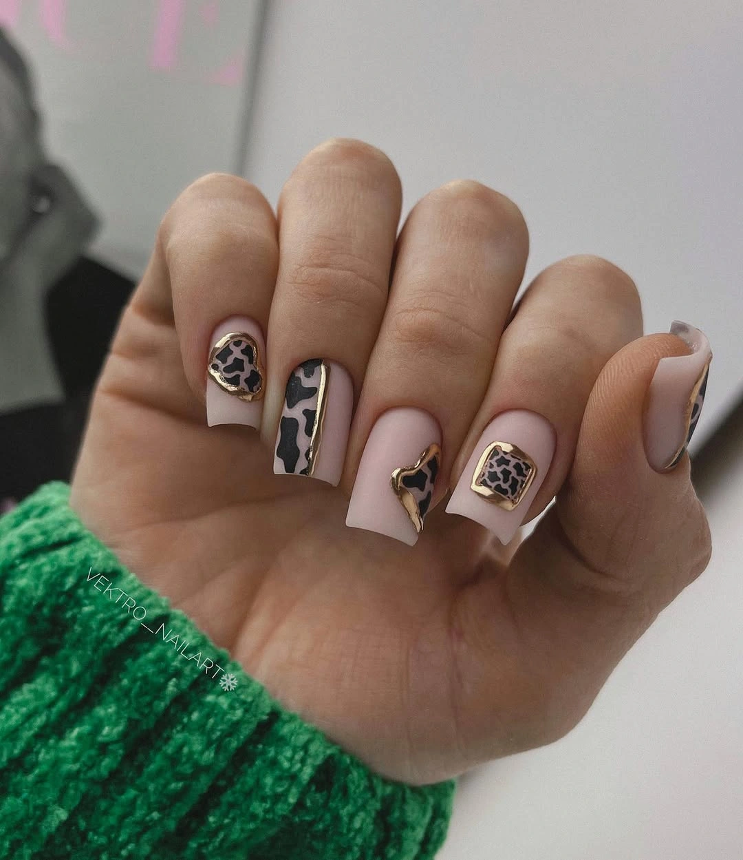 Pale square nails with white tips and dark ornamental lines
