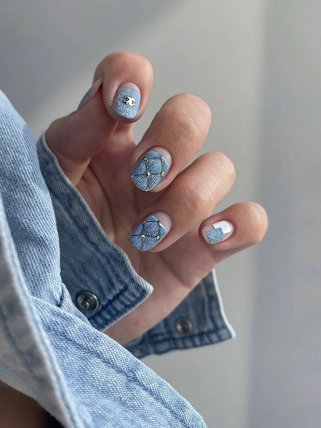 Short blue gray nails with small silver accents