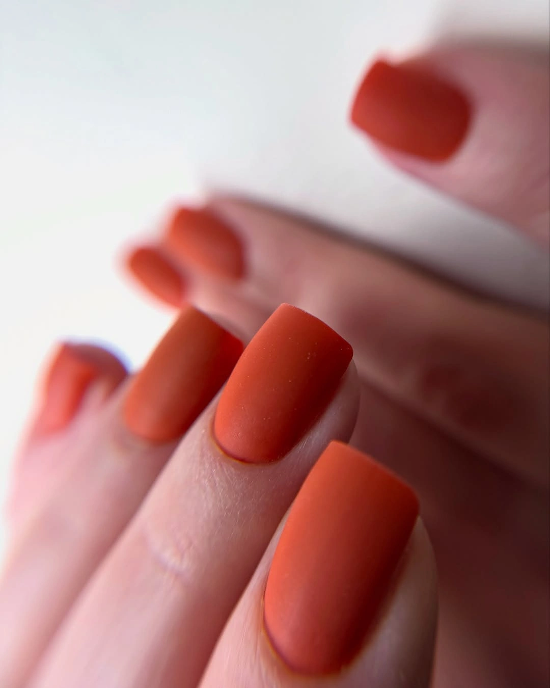 Medium square nails in saturated matte orange