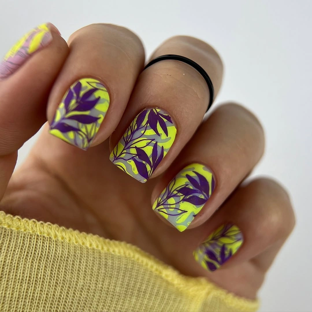 Short square purple nails with lime yellow abstract swirls