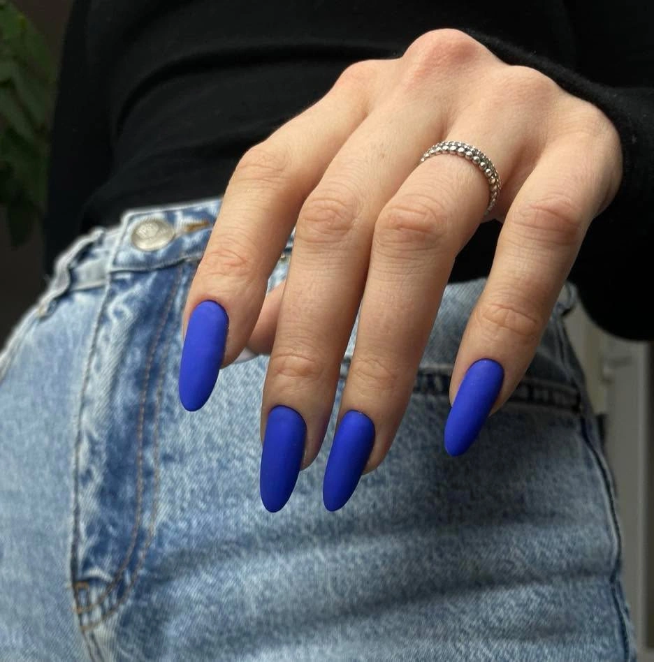 Long tapered cobalt blue nails with a smooth finish
