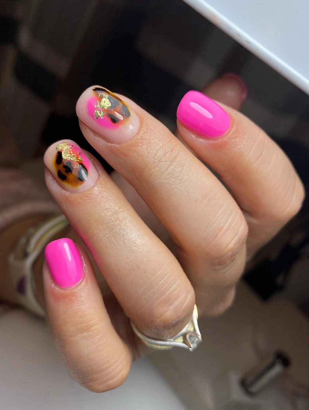 Hot pink medium square nails with abstract gold accents