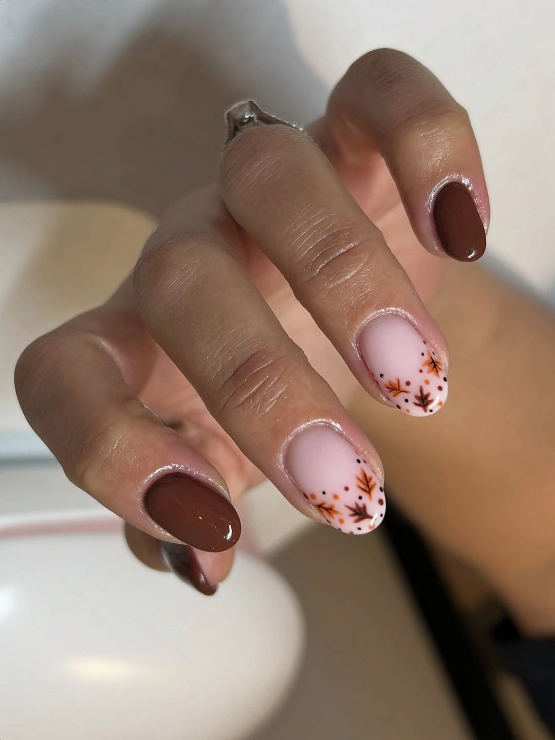 Chocolate almond nails with pale pink botanical accents