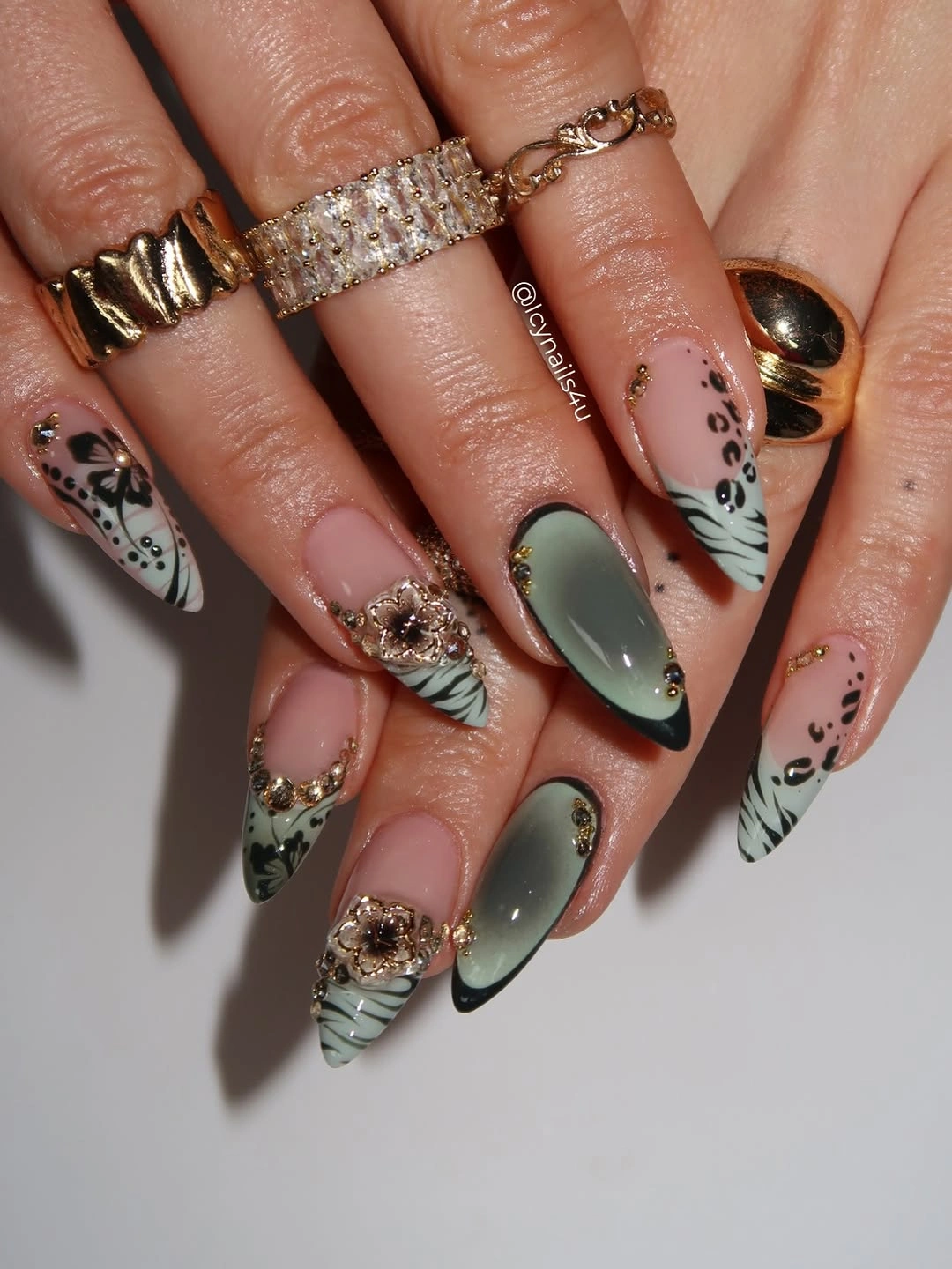 Long almond nails with olive botanical lines and gold accents