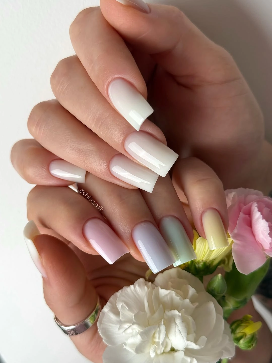 long square pale nails with lavender shading and yellow accents