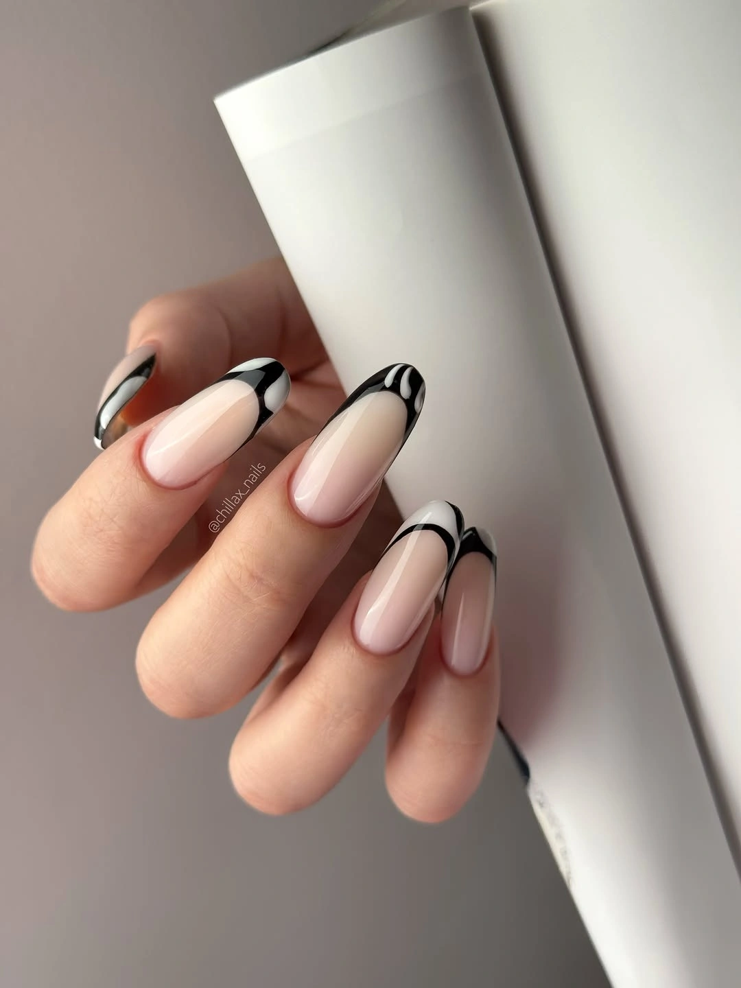 long almond nails with black outlined French tips
