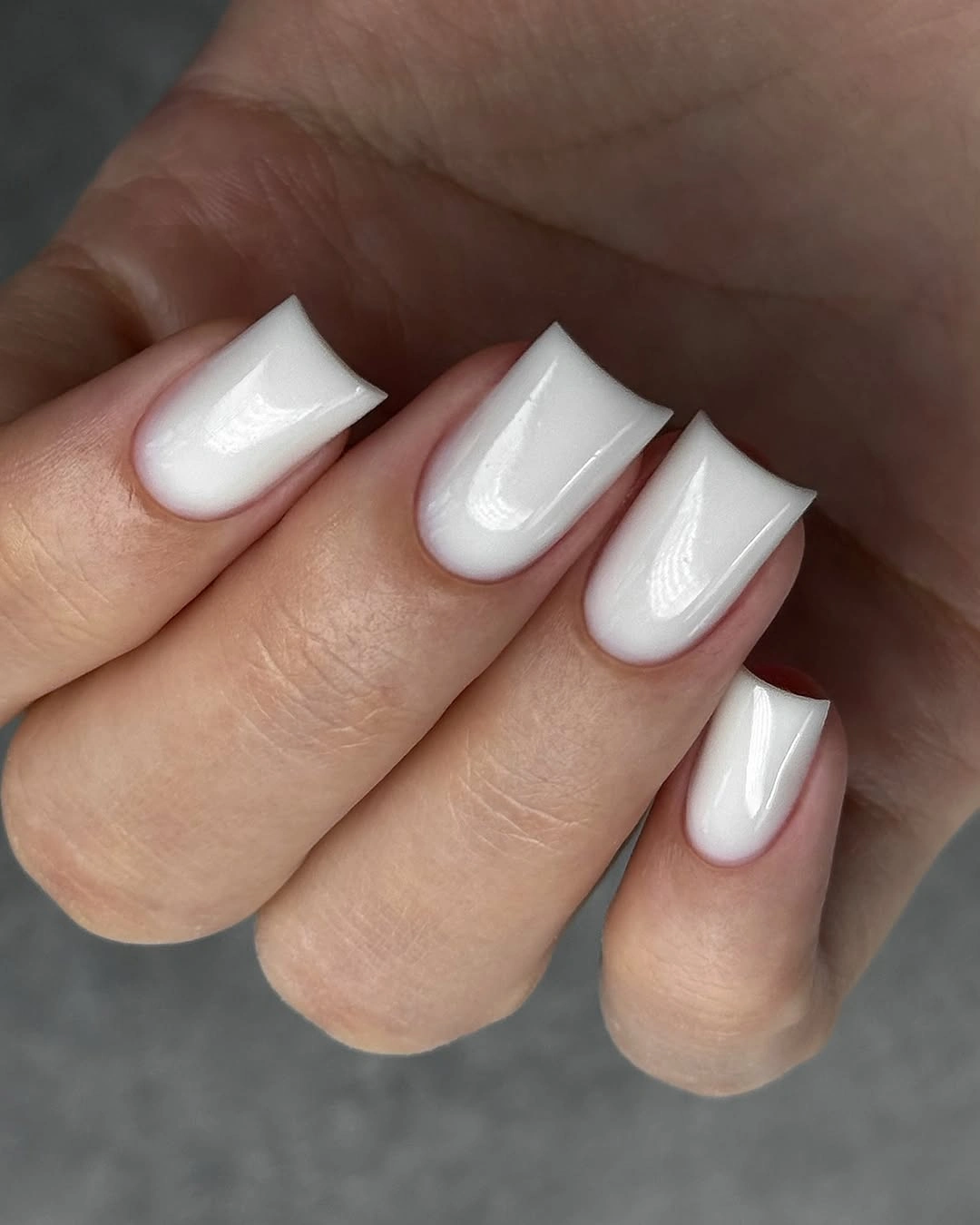 medium white square nails with clean pale French ends