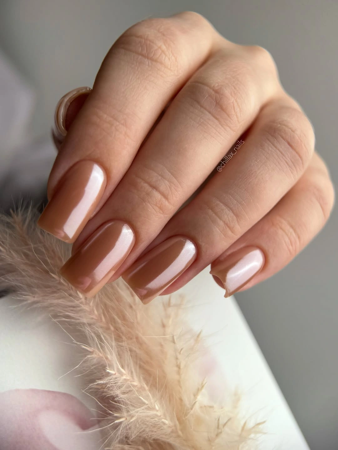 medium square nails in glossy caramel nude