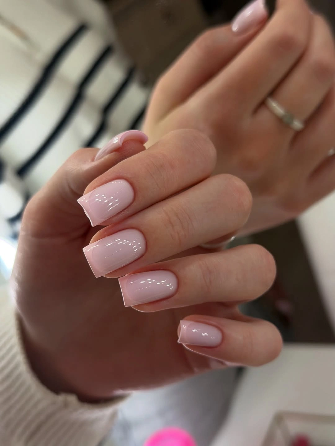 medium pale pink nails with tiny white dot accents