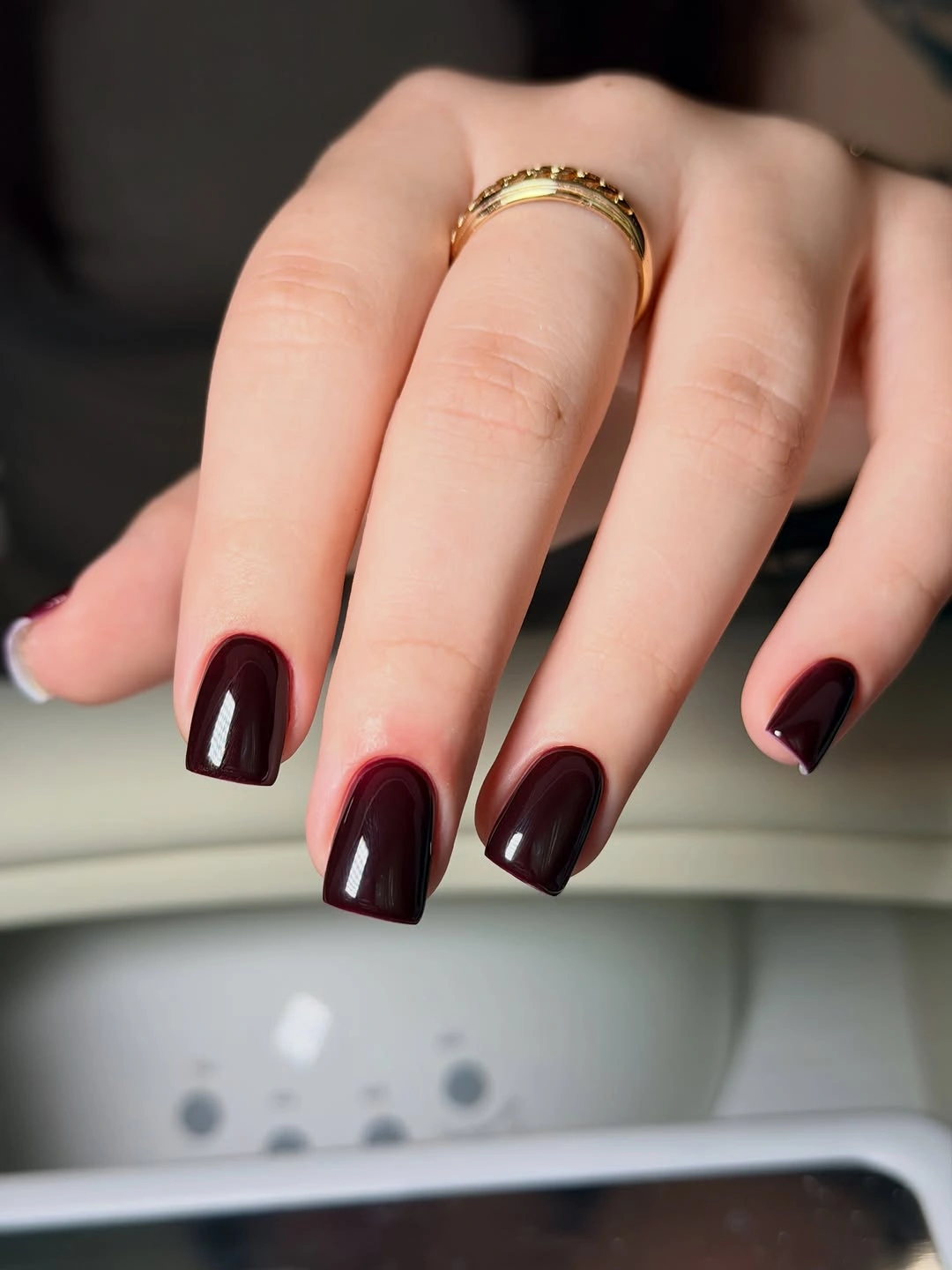 medium square nails in deep glossy burgundy
