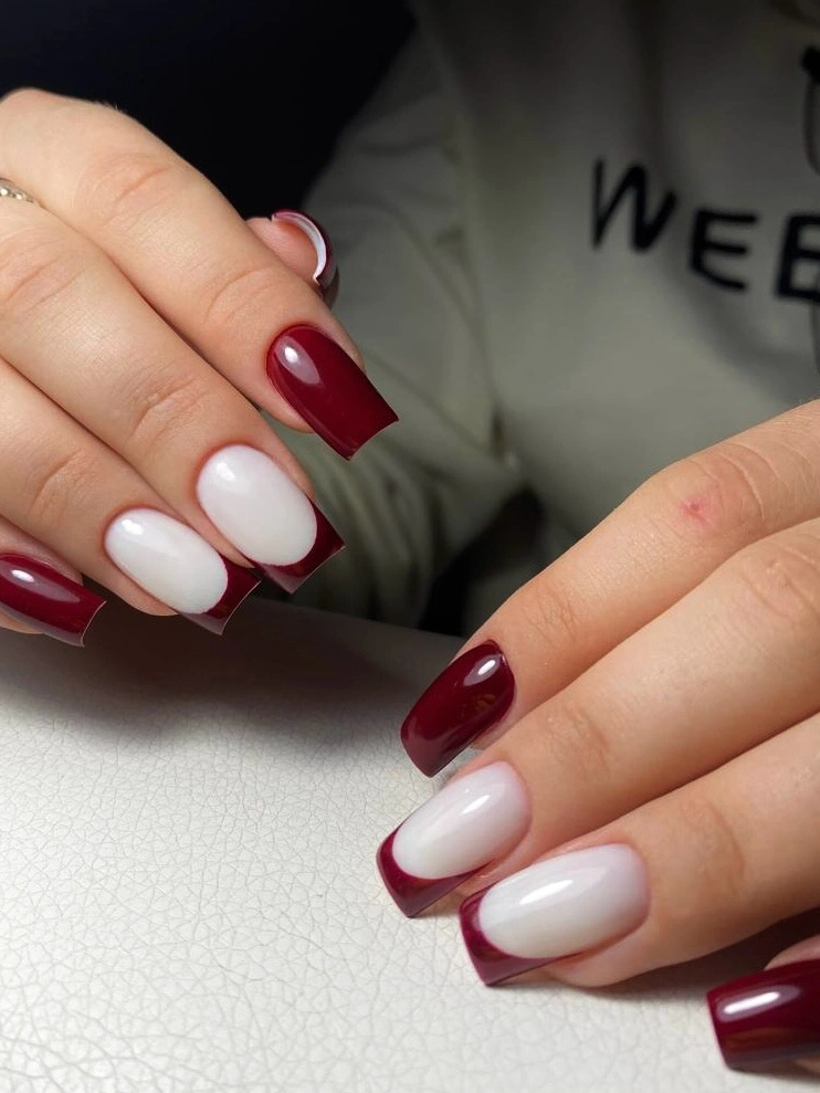 white and burgundy medium-square nails in alternating blocks