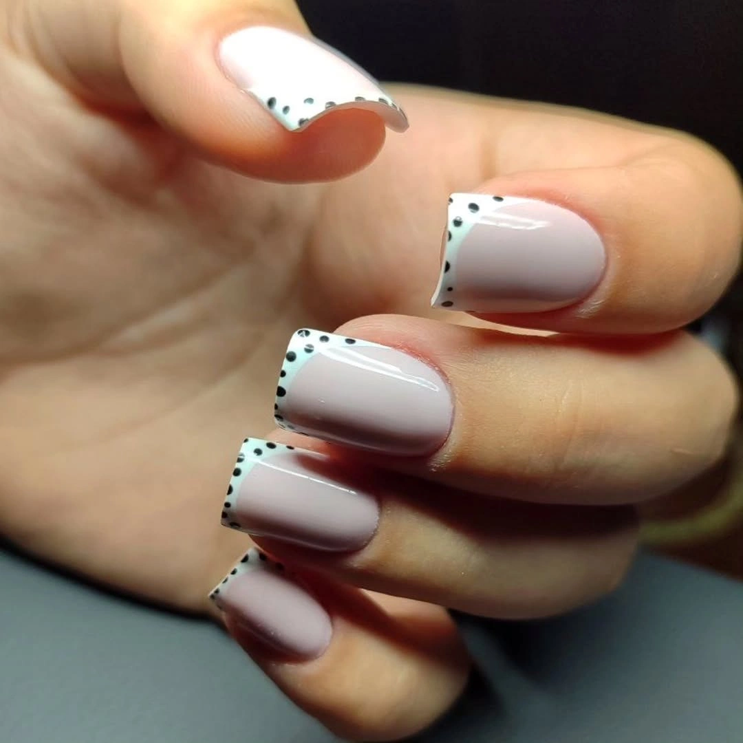 Short square red nails with rounded corners and glossy shine