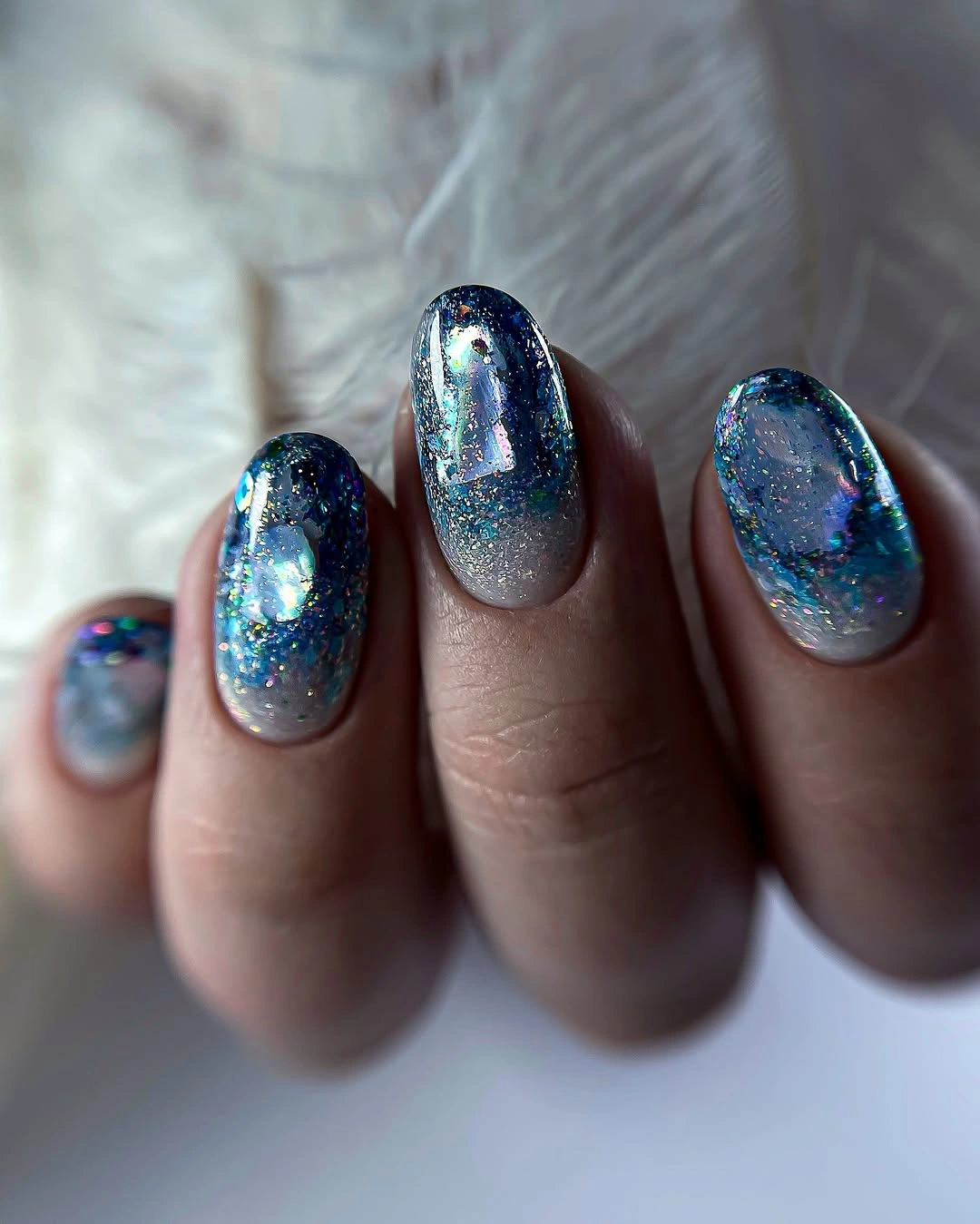deep blue glitter frames on short oval nails