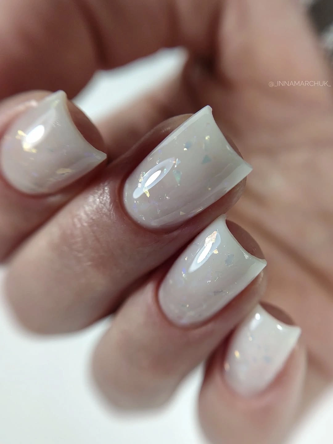 milky white square nails with iridescent flakes