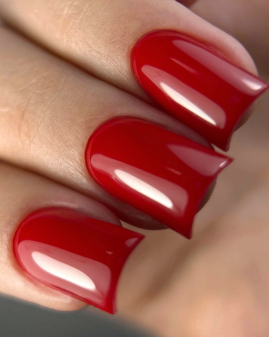 glossy red medium-square nails in a clean color block