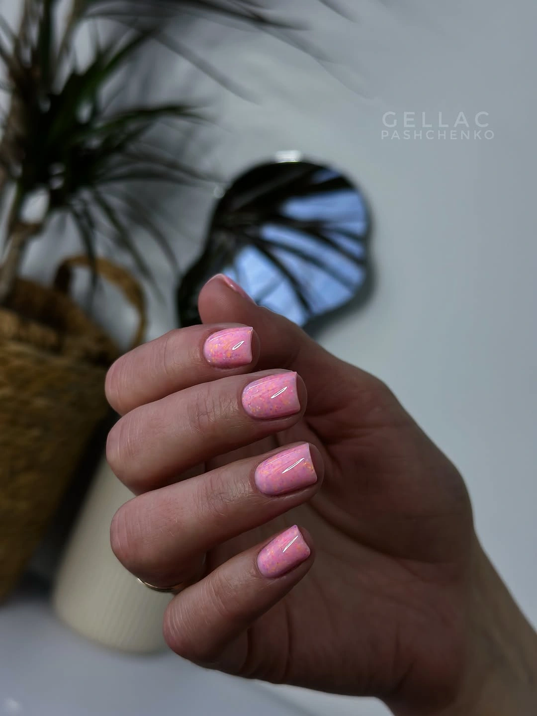 Short pale pink square nails with a soft glossy highlight