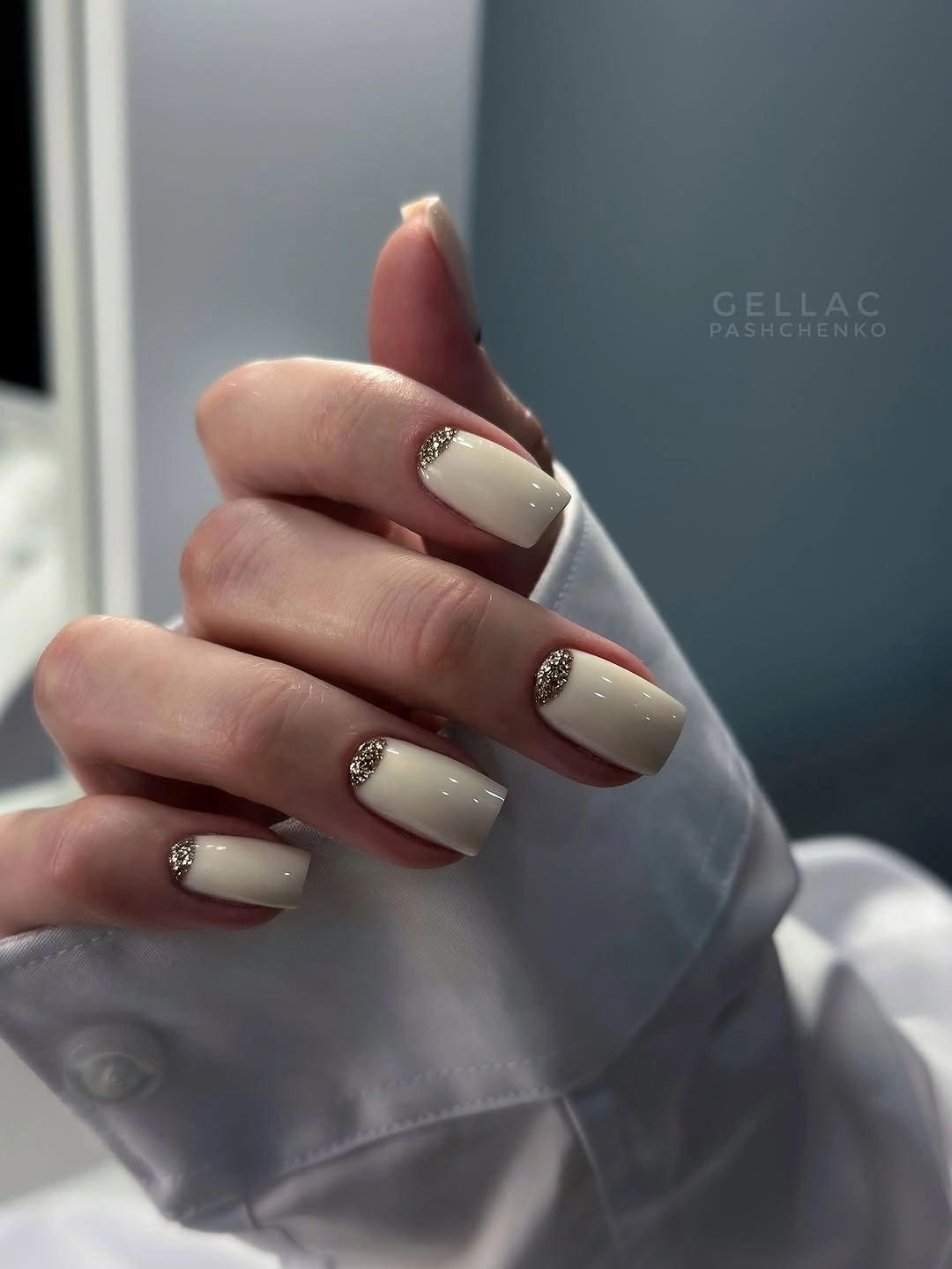 Cream square nails with soft taupe curved accents