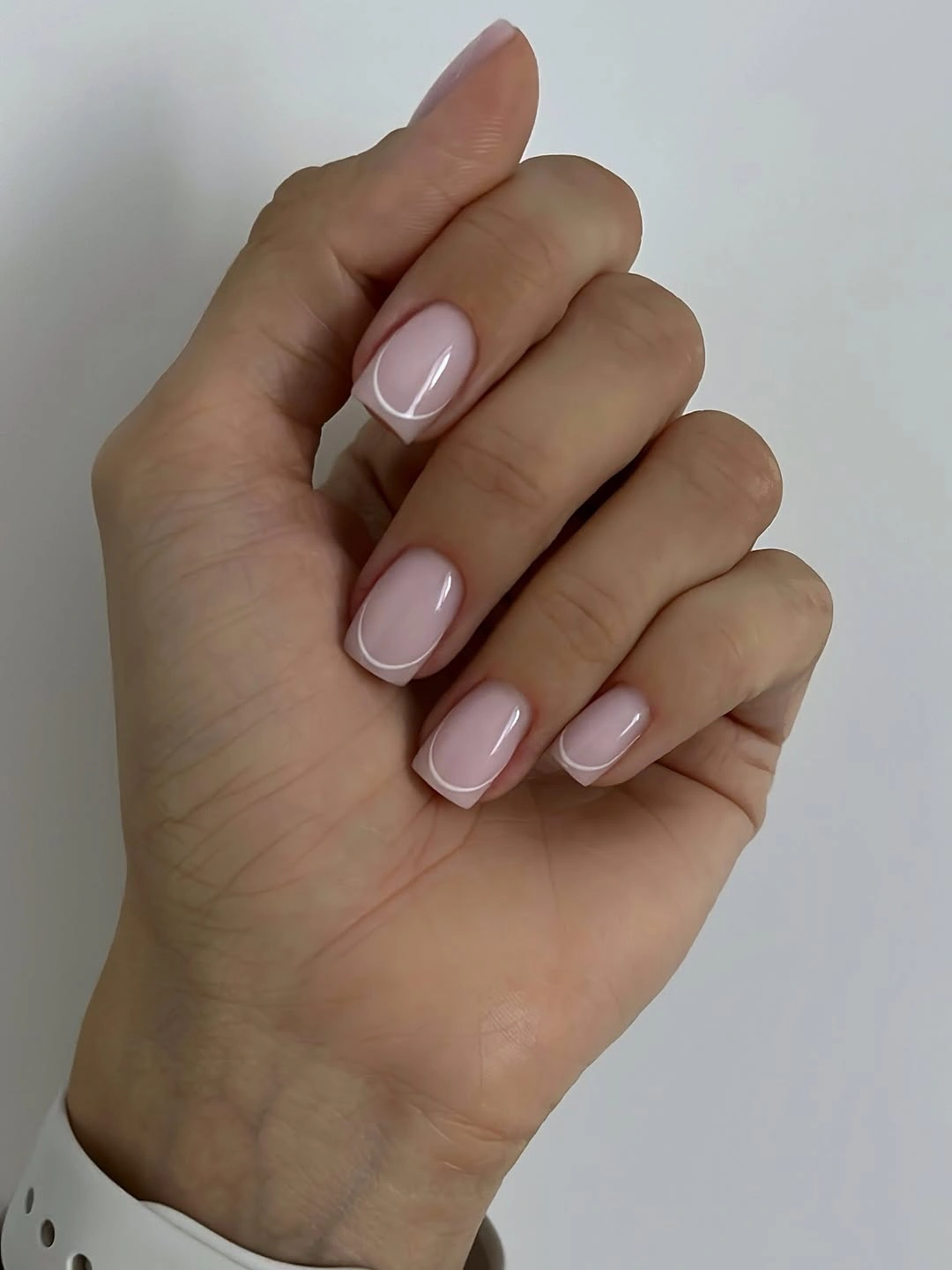 Compact glossy pale blush squoval nails