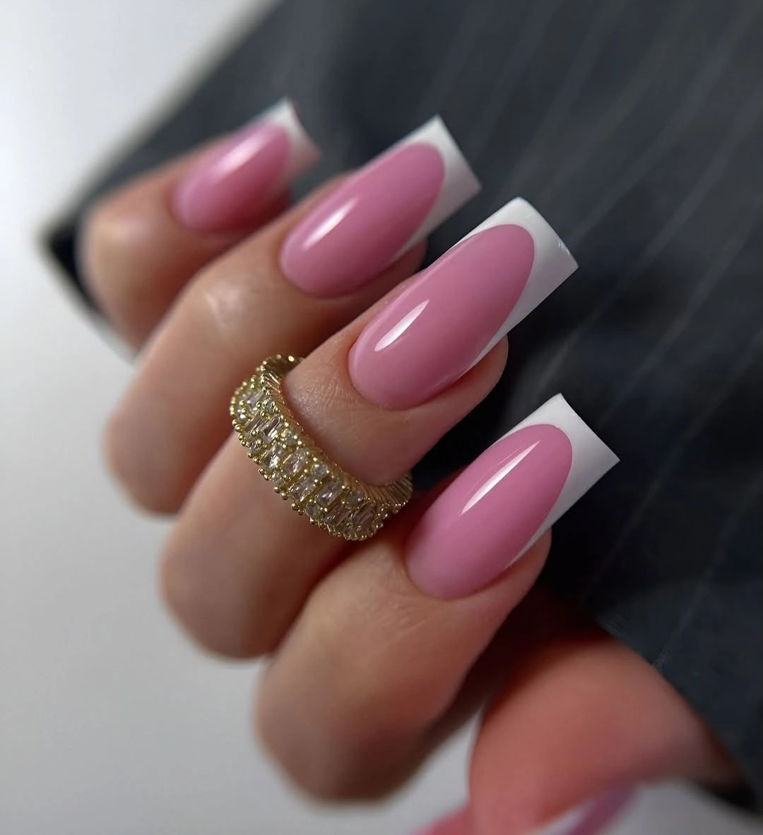 Long pink square nails with one gold glitter band