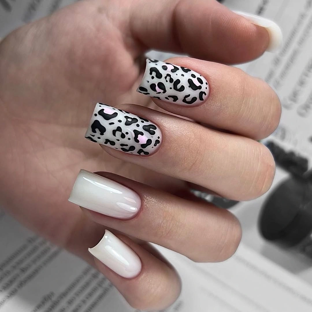 White square nails with black and gray leopard accents